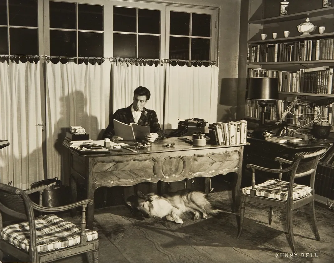 Ortiz posing for a portrait at his desk in California