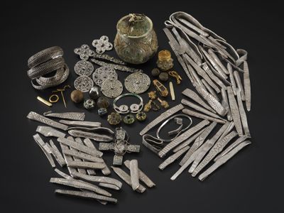 A metal detectorist discovered the Galloway Hoard in a ploughed field in Scotland in 2014.