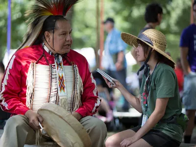 Elisa Hough interviews Dennis Zotigh (Kiowa/San Juan Pueblo/Santee Dakota), a cultural specialist at the National Museum of the American Indian. (Daniel Martinez, Center for Folklife and Cultural Heritage, Ralph Rinzler Folklife Archives.)