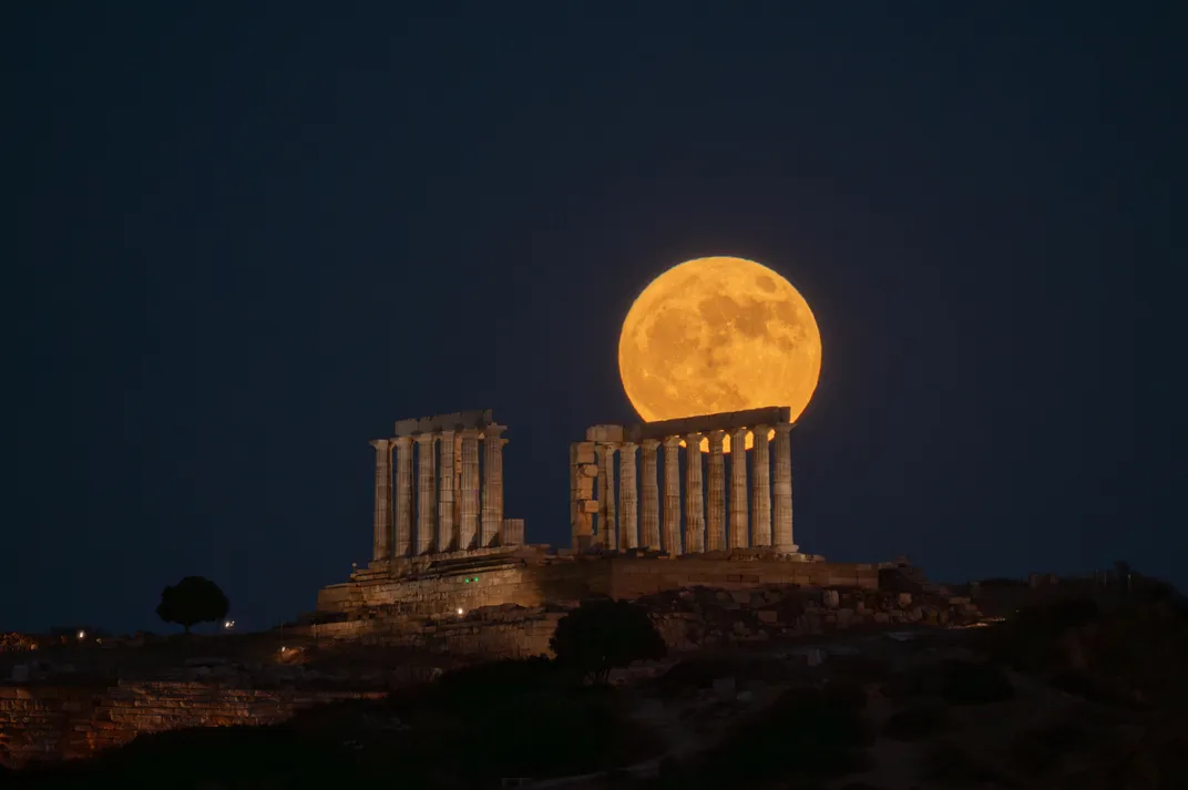 Strawberry moon rises behind the ancient Temple of Poseidon at Cape Sounion, near Athens, Greece, on June 29, 2026