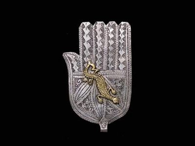 North African artisans combined gold and silver to forge jewelry like the khamsa.