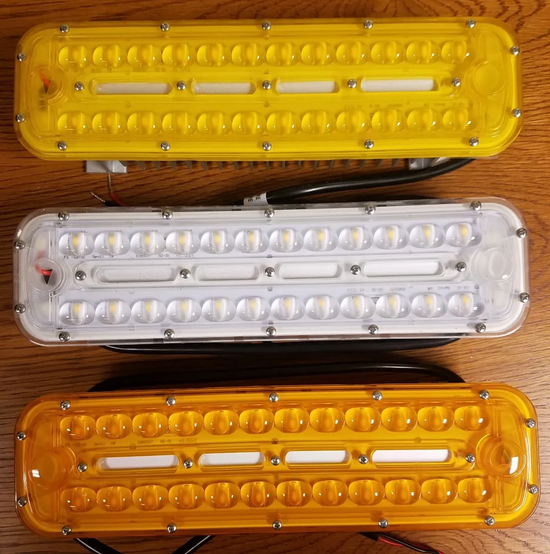 The three lamps used in the study: from top to bottom a LED 3000k lamp with a yellow filter, with no filter, and with an amber filter