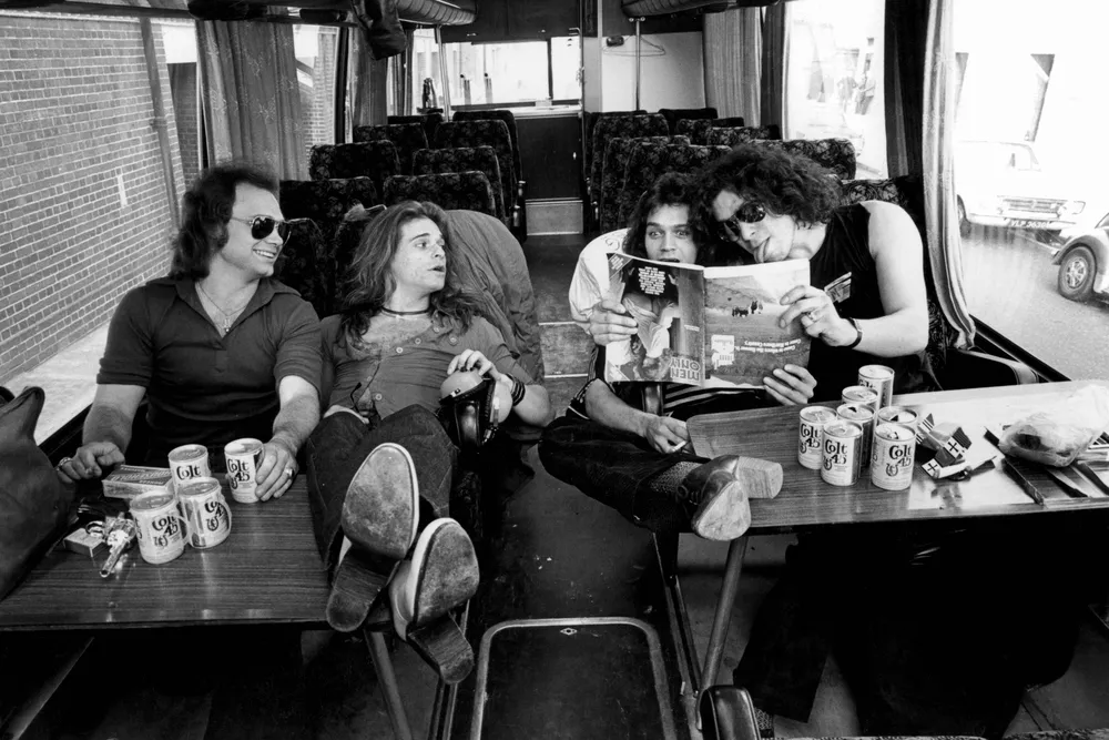 Michael Anthony, David Lee Roth, Eddie Van Halen and Alex Van Halen pose on a tour bus in 1978.