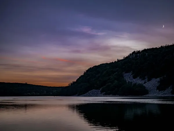 Sunset beyond the bluffs with it’s friend, the moon. thumbnail