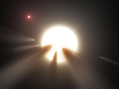 The swarm of dusty comets in this artist's conception is one of several not-entirely-convincing explanations for what's happening around the star called KIC 8462852.