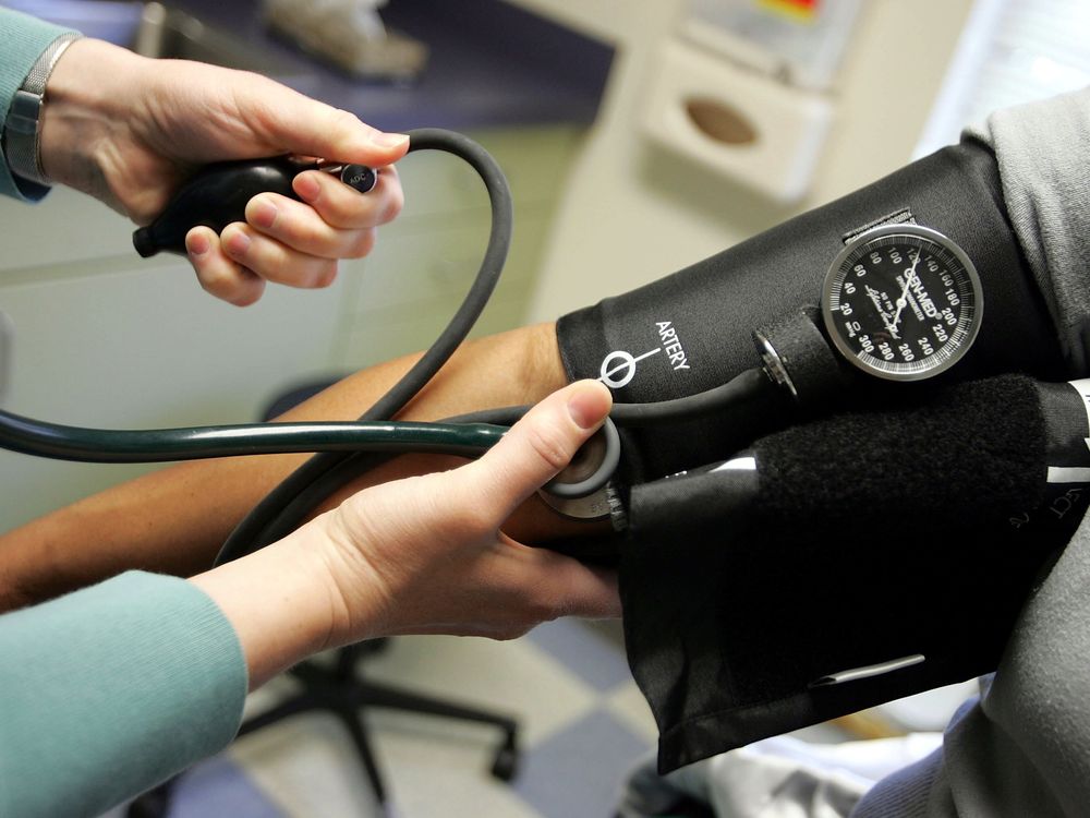 A person gets their blood pressure measured