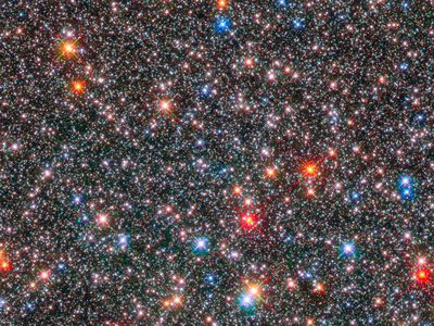 The smaller white stars in this Hubble Space Telescope image of the central region of our galaxy are of the same type as the Sun. But our local star may be unusual in its ability to foster life.