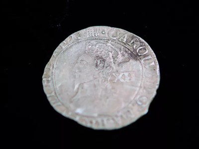 A silver shilling recently found at the former site of St. Mary's Fort, one of the first colonial settlements in British North America