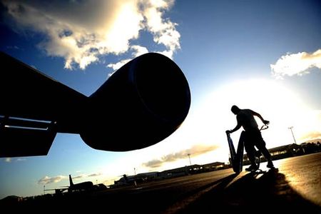 Senior Airman Jonathan Ordonez prepares to cover a KC-135 Stratotanker engine after a refueling mission July 8, 2010, during the Rim of the Pacific 2010 exercise at Hickam Air Force Base, Hawaii. The exercise includes 14 nations, 34 ships, five submarines, about 100 aircraft and more than 20,000 participants. Airmen Ordonez is a crew chief with the 507th Aerial Maintenance Squadron at Tinker AFB, Okla. (U.S. Air Force photo/Master Sgt. Jeremy Lock)