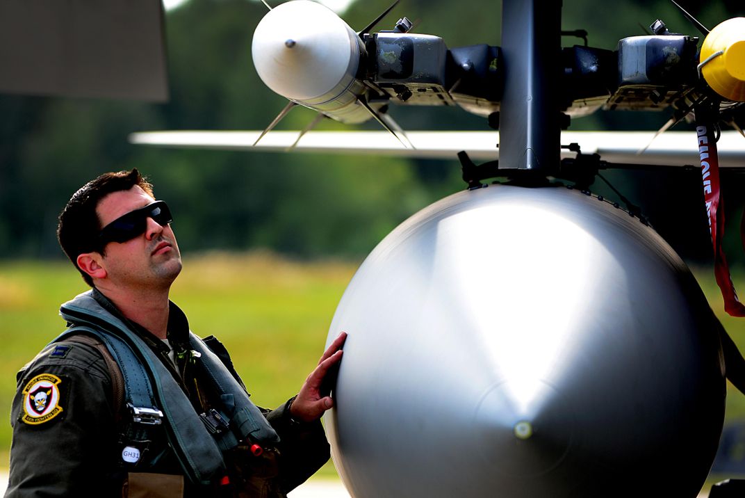 F-15 pilot inspects fighter