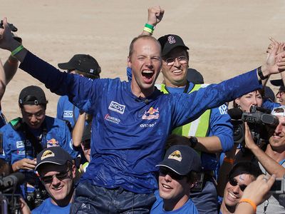 Stanford University Racing Team leader Sebastian Thrun celebrates with his team mates as their entry named "Stanley" is the first to cross the finish line at the Defense Advanced Research Projects Agency (DARPA) 2005 Grand Challenge in Primm, Nevada. 