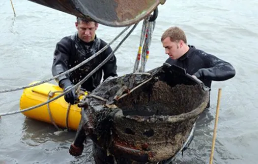 It's not just the  river: Royal Navy Bomb Disposal team divers lift a World War II-era V-2 rocket from the seabed at Harwich, Essex, in 2012. The rocket was donated to the local sailing club, which had reported the rocket's location to the Essex Police.