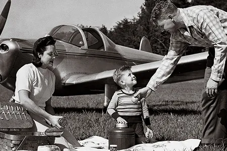 “If you can drive a car, you can fly an airplane.” ERCO began selling the spin-proof Ercoupe from department stores in 1945 by marketing the vision that every family (represented in the publicity shot) could own one.