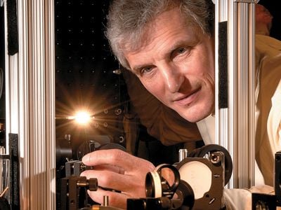 Bright idea: Wolfgang Ketterle (in his M.I.T lab) hopes to discover new forms of matter by studying ultracold atoms.