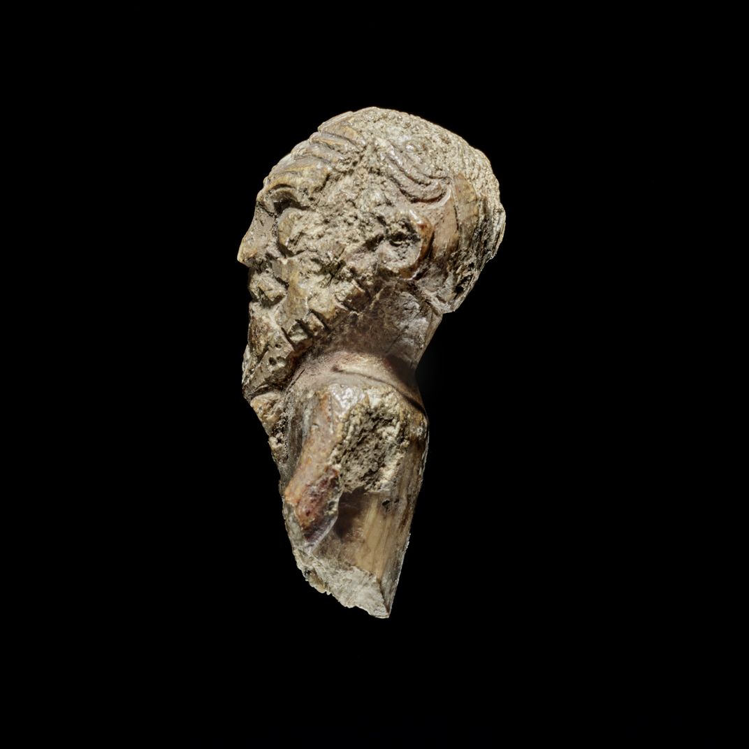 Side of a figurine with wavy hair