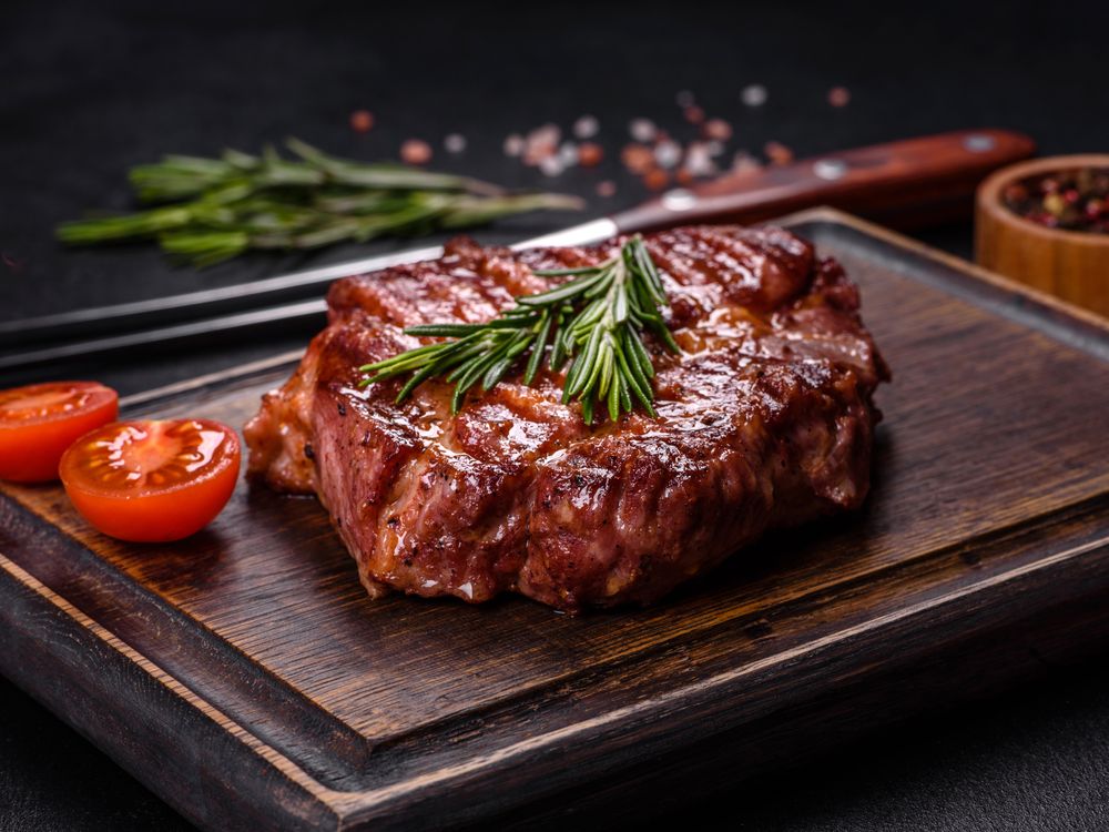 a serving of steak on a board