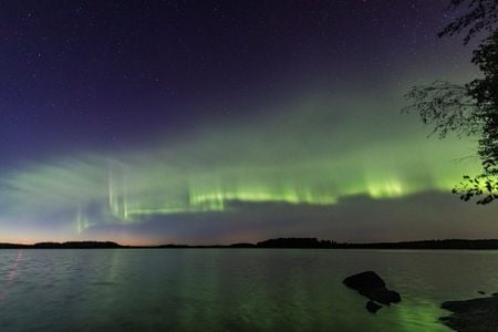 A new type of aurora, called auroral dunes, produces horizontal, undulating stripes of green that resemble mounds of sand on a beach.
