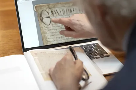 Historian David Carpenter examines the digitized document.