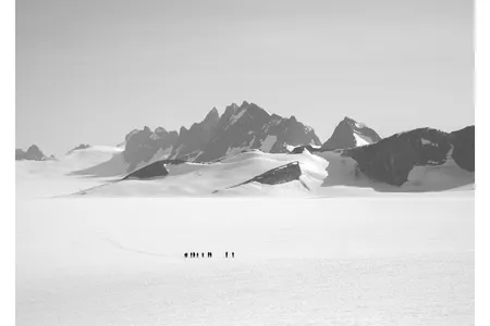 A team skis from the remote Taku D site to the Camp 10 sleeping quarters. Students often travel as much as 8 to 10 miles a day, carrying packs a third of their body weight.