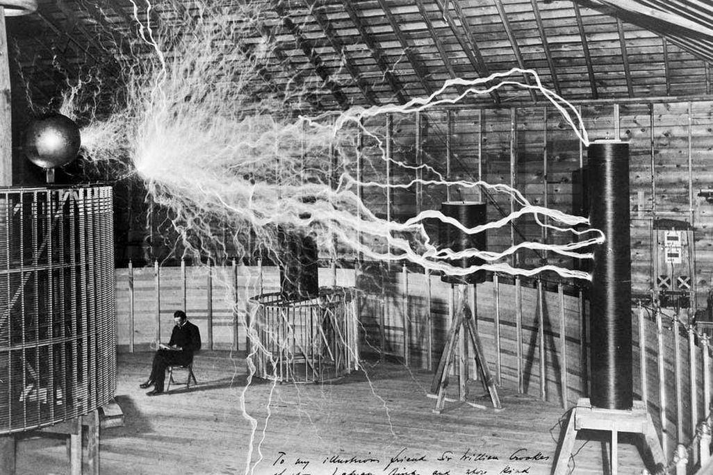 The inventor at rest, with a Tesla coil (thanks to a double exposure).