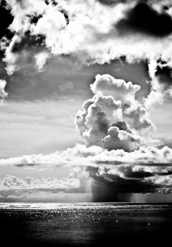 When you are in the middle of the Pacific, storm clouds become characters amongst themselves. They have this personality. This was taken off the coast of Saipan which is north of Guam in the Commonwea thumbnail