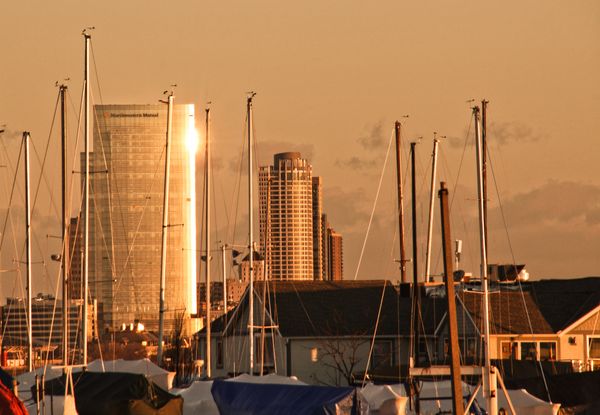 the magnificent newly built North Western Mutual high rise, resting behind the South Shore Yacht Club sailboats   thumbnail