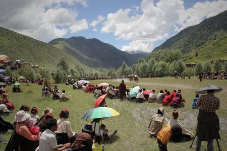 Once the track is formed with "people fences" on either side, crossing is strictly prohibited—they believe "cutting" it will upset the deities and lead to accidents during the race. Now with improved transportation in the region, more outsiders visit Dzongsar for the festival and often break this rule.