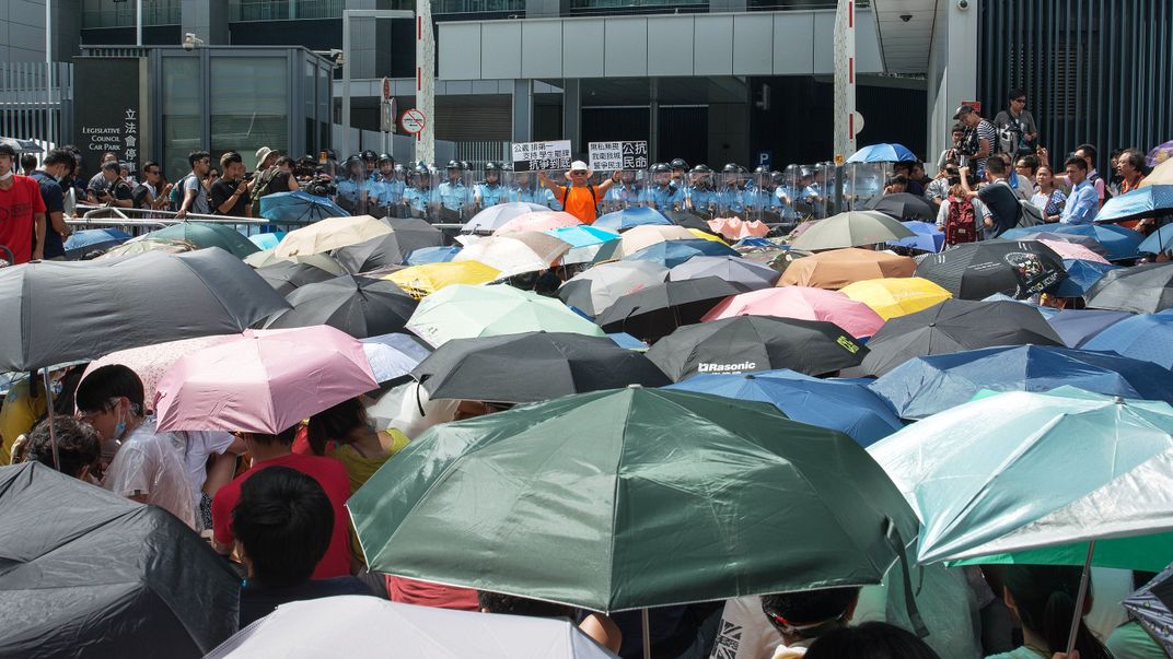 Protesters in Hong Kong in 2014 use umbrellas to shield themselves from tear gas and water cannons.