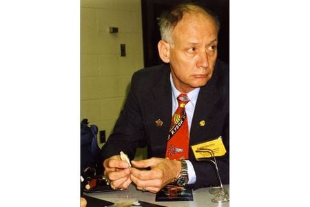 William Maples holds a bone fragment during a presentation about the Romanov Investigations, circa 1992.