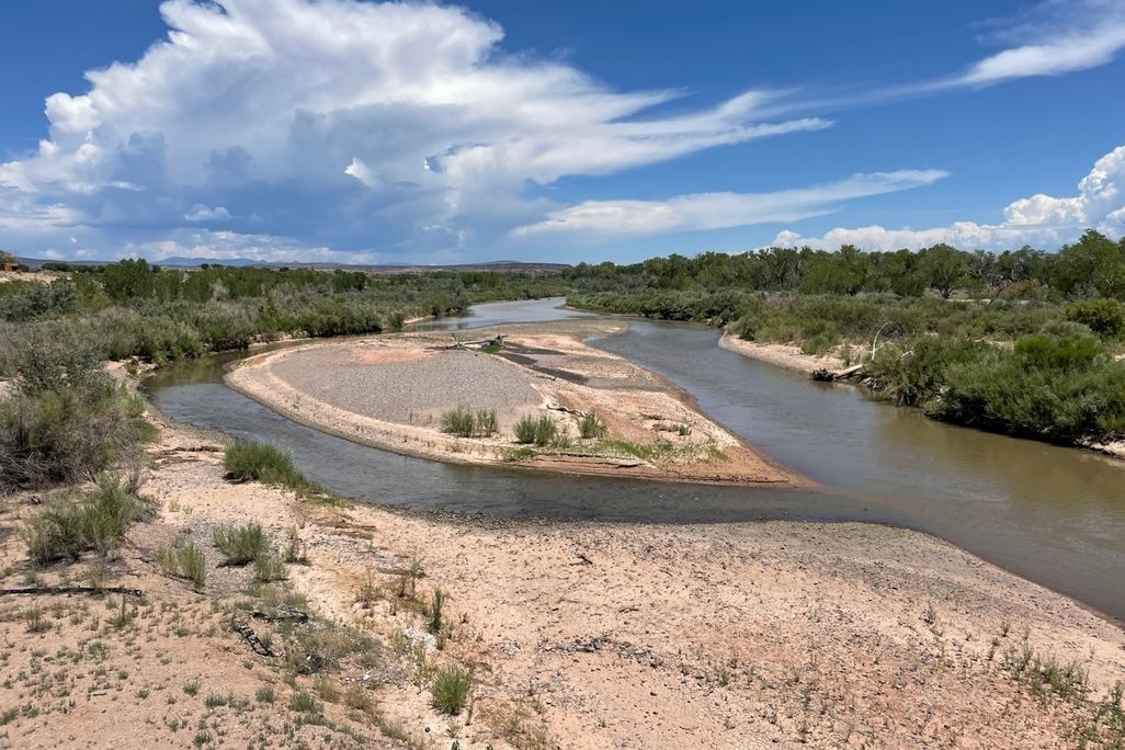 A river splits around a sand bar