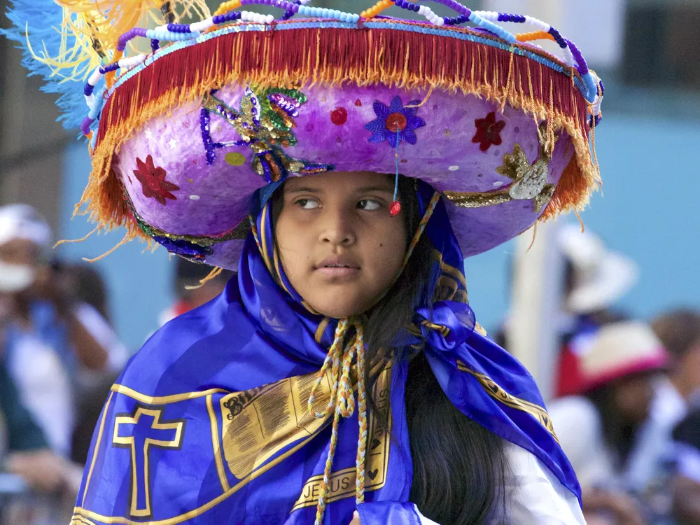 a person in colorful clothing in a parade