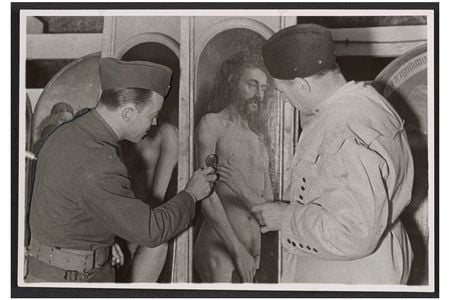 Lieutenant Daniel J. Kern and Karl Sieber examining a panel of the Ghent Altarpiece, 1945.