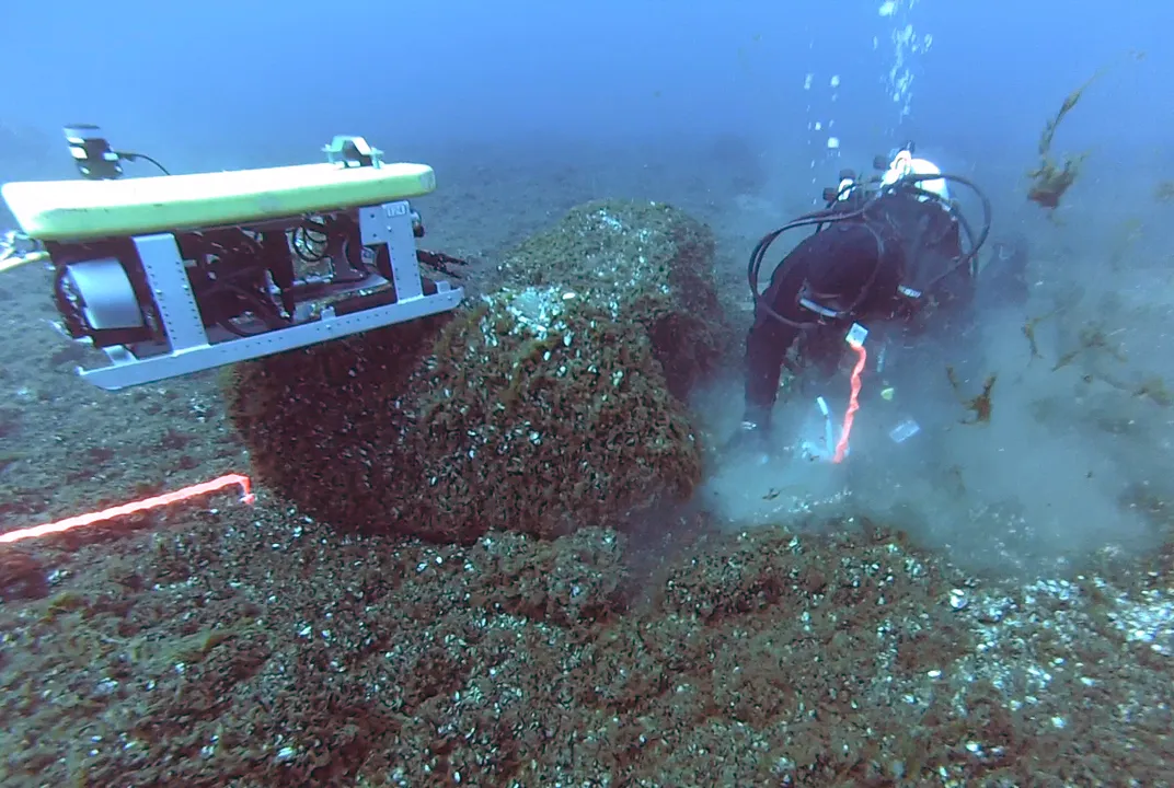 Diver Tyler Schultz excavates a site on the Alpena-Amberley Ridge in Lake Huron.