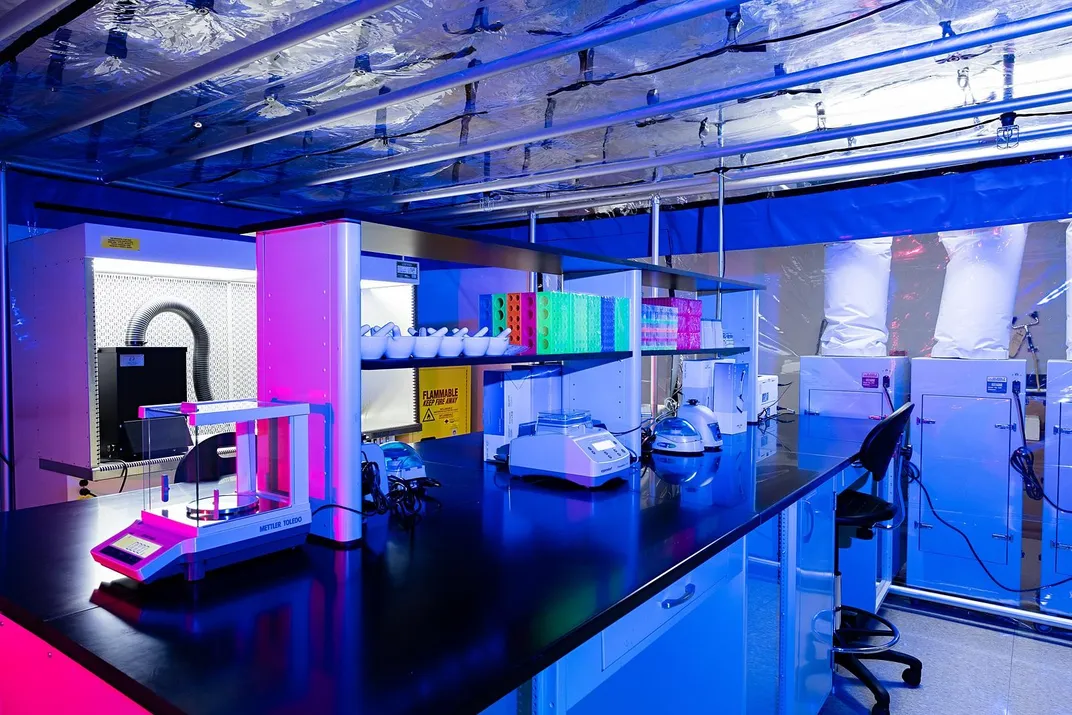 A scientific lab inside a plastic structure.