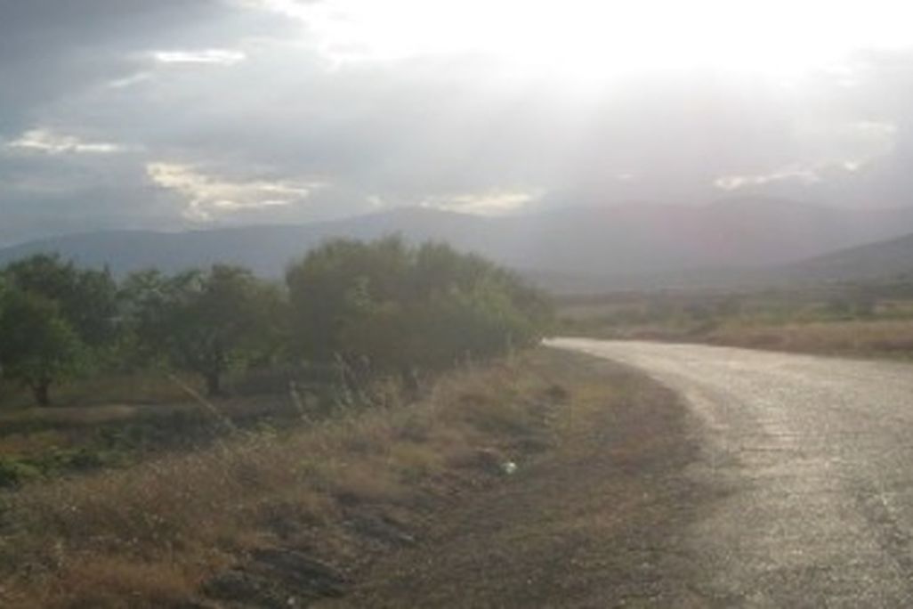 Sunlight bursts through a ceiling of rainclouds above the lonely west shore of Lake Burdur.
