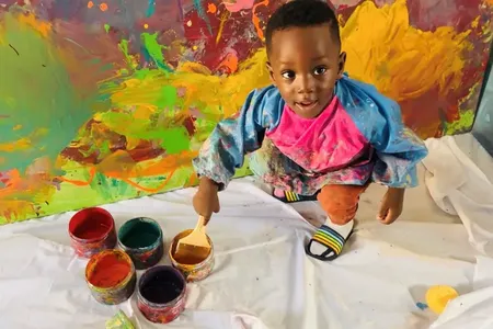 Ace-Liam Ankrah works on a painting.