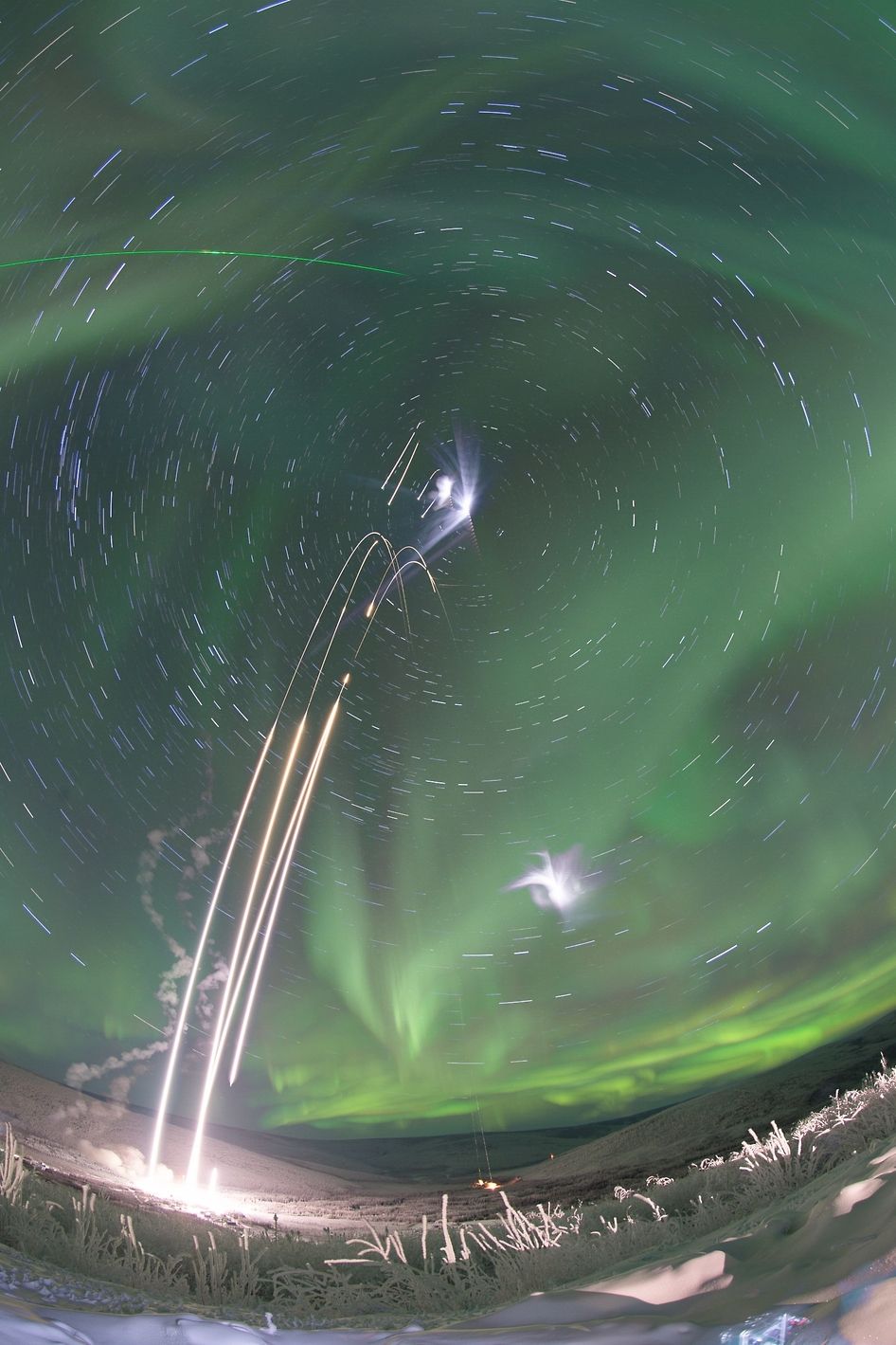 Cosmic Jaw-Droppers Include a Twisted Galaxy and an Aurora Rocket