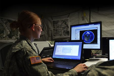 Geospatial engineer Private Miranda Yost of the 117th Space Battalion works with software that helps troops and emergency response teams target locations.