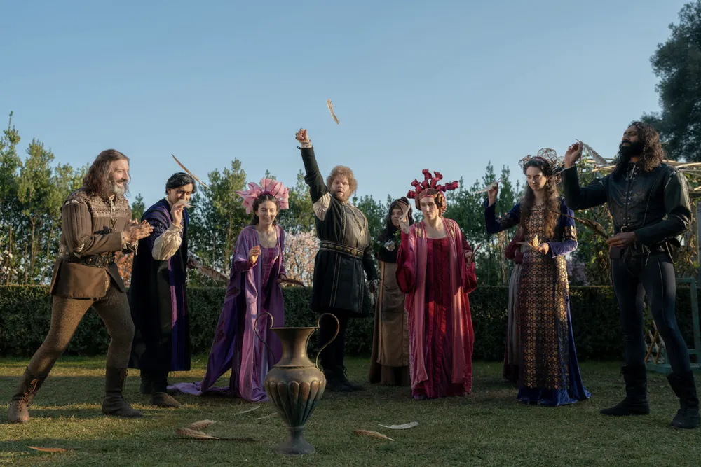 The cast of Netflix's "The Decameron" playing a game outside