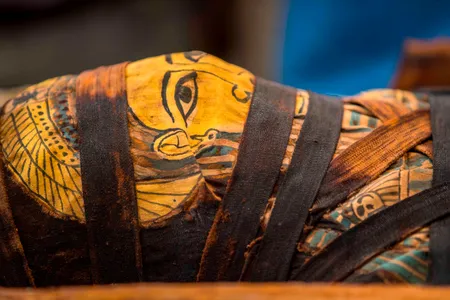 The deceased's mummified remains were wrapped in burial linen and laid to rest in a wooden coffin.