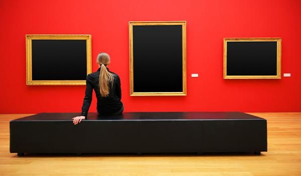 Woman looking at empty frames