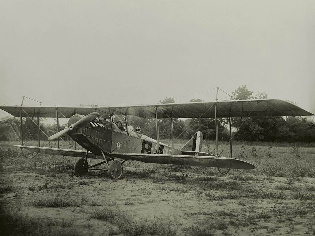 Curtiss Jenny in a field