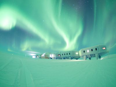 The Halley VI Research Station underneath the aurora in Antarctica. 