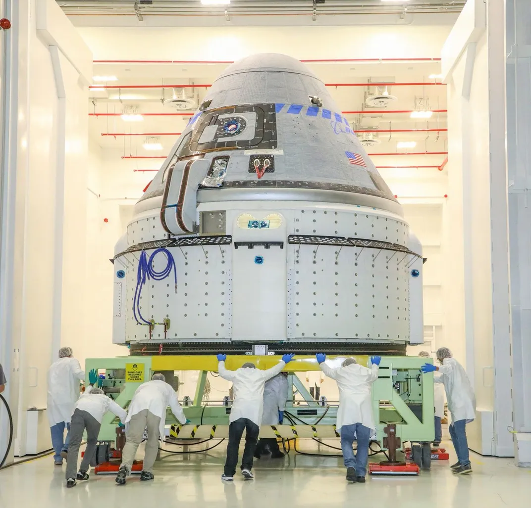 The CST-100 Starliner spacecraft, photographed in 2019 during launch preparations.