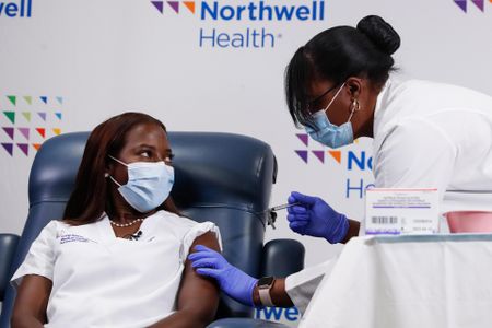 Nurse Sandra Lindsay of Long Island Jewish Medical Center in Queens, New York City, received the first Covid-19 vaccine in the United States in December 2020. Here, she is pictured receiving her second dose of the Pfizer vaccine in January.
