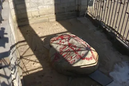 The iconic Plymouth Rock and other sites were covered in red graffiti Monday during a vandalism spree discovered at the site marking the landing of the Pilgrims in Massachusetts 400 years ago.