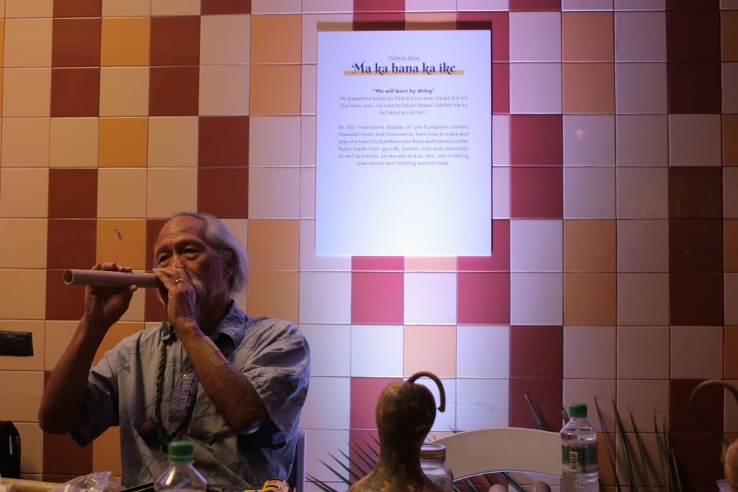 man playing Hawaiian nose flute