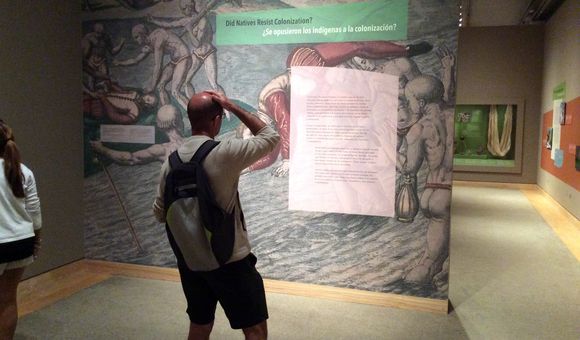 Visitors in the gallery are confronted not just with the violence of colonization, but with the agency of Native and African resistance in the Caribbean, as well. Graphic design by Barbara Suhr for NMAI. Photo by Lawrence Waldron.