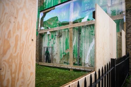 Wooden boards and plastic screens surround Banksy&#39;s latest confirmed artwork in London.