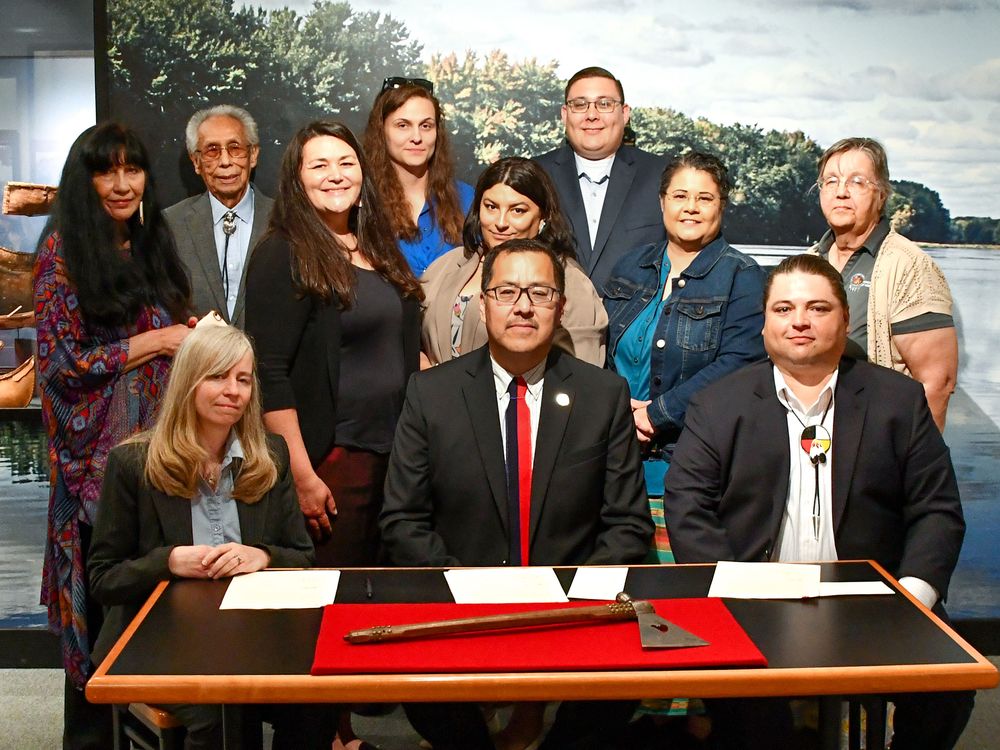 Members of the Ponca delegation pose with the repatriated pipe tomahawk